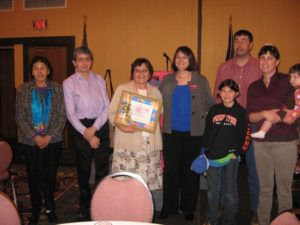 Ms. Johnston and her family with Denise Juneau, State Superintendent of Public Instruction