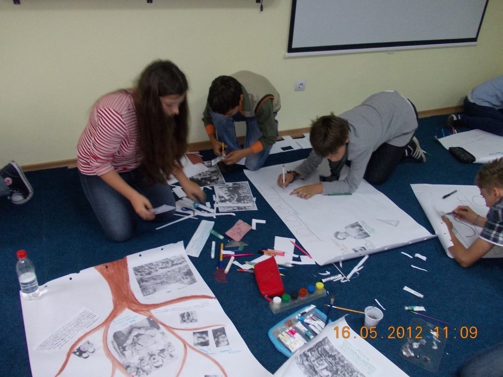 Middle school students work on thematic posters about the Holocaust in Romania as part of a Memory of the Holocaust national competition at the Ilfov Teacher Training Institute. 
