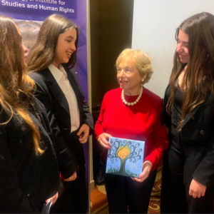 Assia Raberman, 94, with students in Athens, Greece, where she spoke about her experiences as a child during the Holocaust in Poland. The students created a project for their school on Holocaust and Humanity, one of 200 projects sponsored by TOLI.